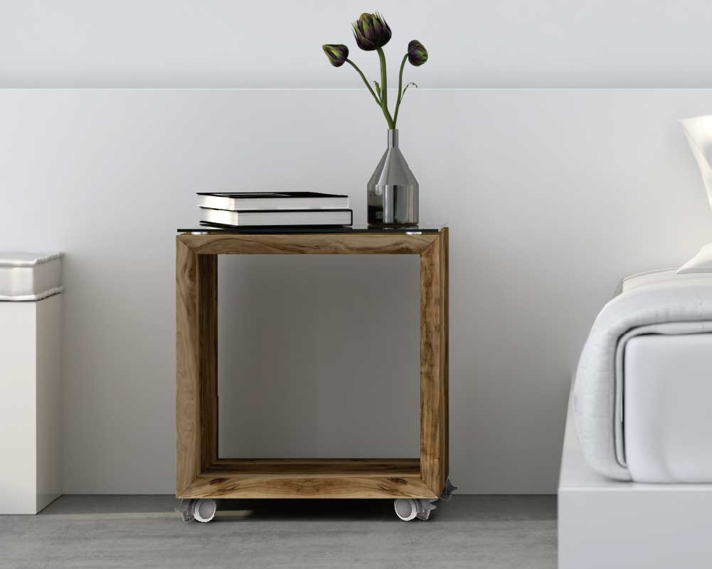 Wooden bedside table on furniture casters for easy mobility