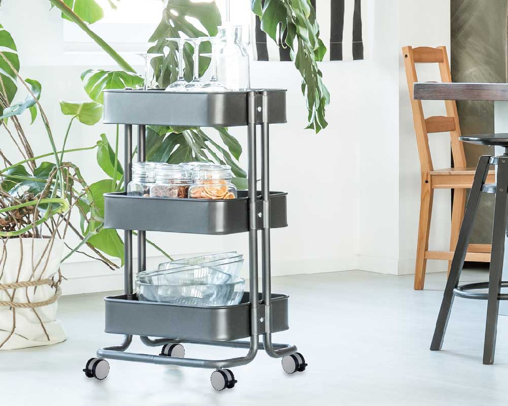 Three-tier rolling cart with storage in a cozy room setting